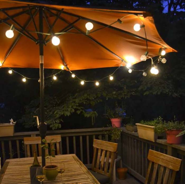 Simple Bulbs Make Umbrellas Useful for Night Lighting #lighting #yard #outdoor #decorhomeideas