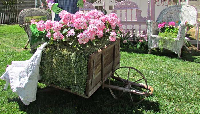 Vintage Hay Wheelbarrow Decorated for Spring #spring #garden #decorhomeideas