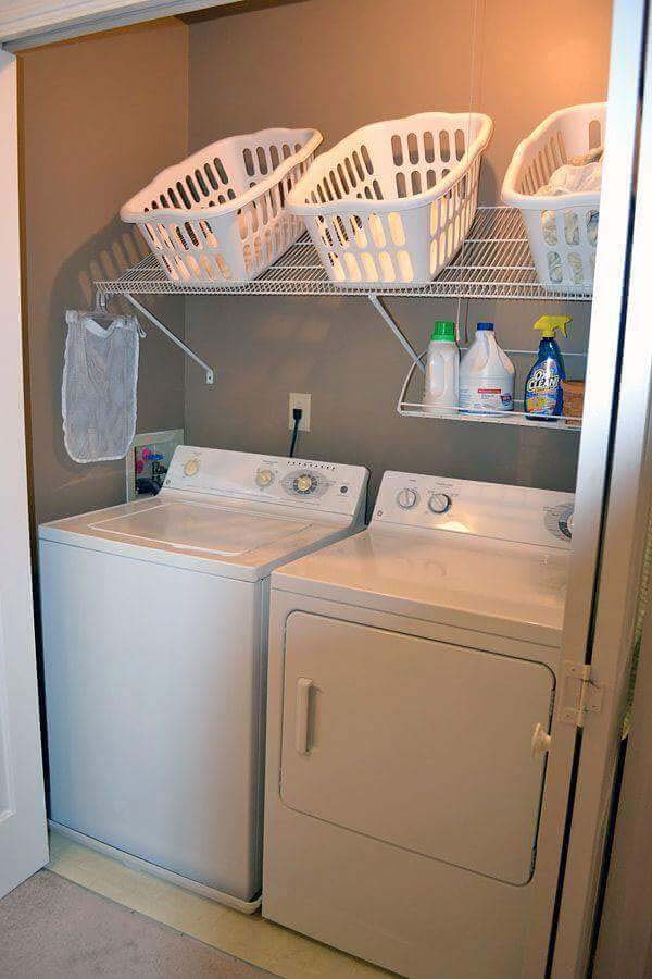 Angled Shelving Conveniently Holds Laundry Baskets #storage #organization #decorhomeideas