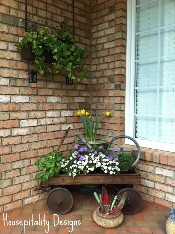 Antique Wagon, Watering Can and Potted Flowers #rustic #springdecor #porch #decorhomeideas