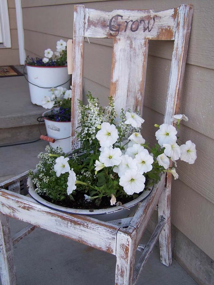 Distressed Wooden Chair With Potted Flower Arrangements #rustic #springdecor #porch #decorhomeideas