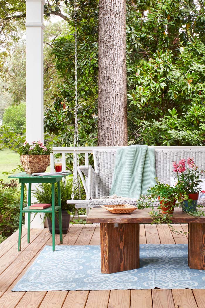 Outdoor Living Room With Wicker Porch Swing #rustic #springdecor #porch #decorhomeideas