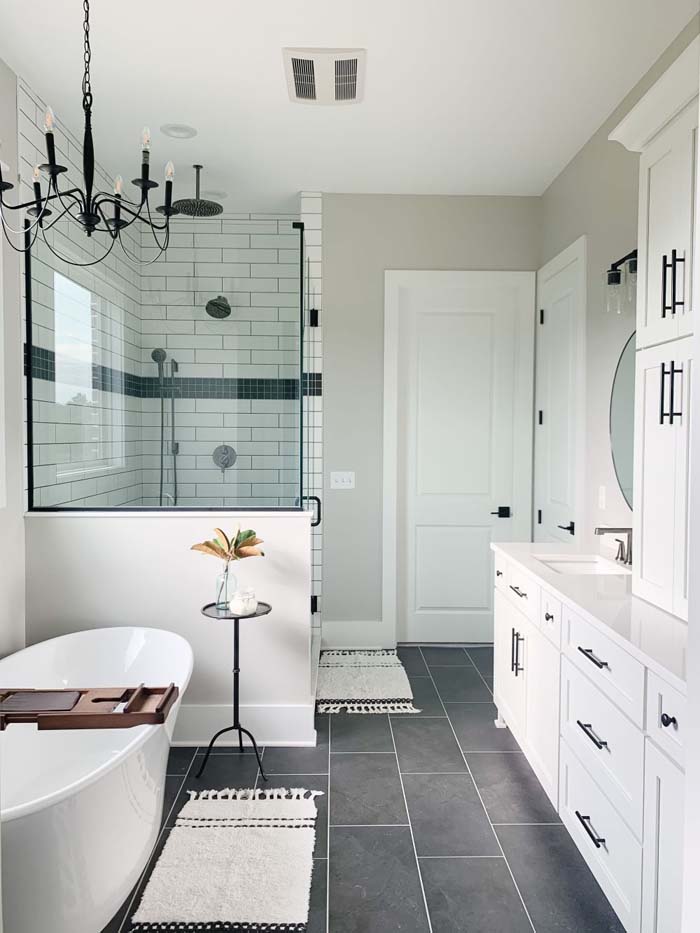 White Metro Tile With Dark Tiled Floor #bathroom #whiteshowertile #decorhomeideas