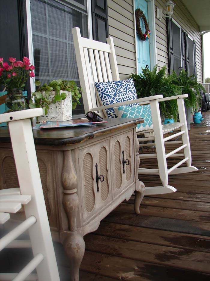 Wooden Table, Rocking Chairs, and Patterned Pillows #rustic #springdecor #porch #decorhomeideas