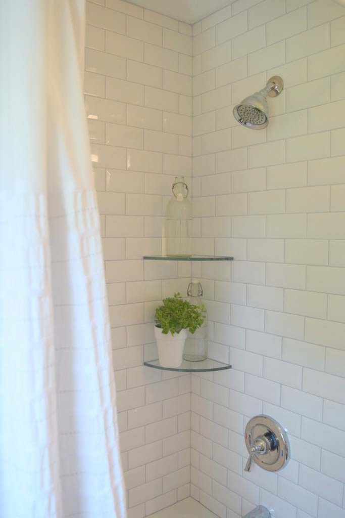 Clear Glass Shelves Float In A White Shower