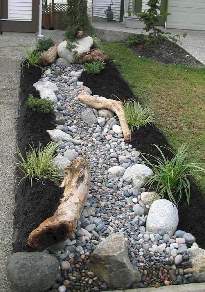 Driftwood-Accented Riverbed Garden #smallgarden #gardendesign #decorhomeideas