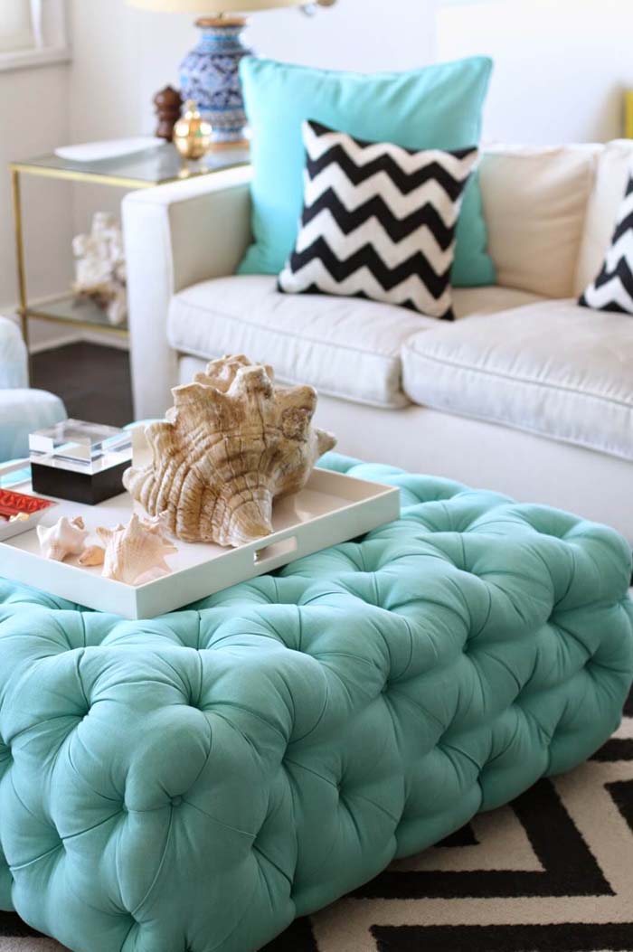 Turquoise Ottoman in a Shell-Inspired Living Area #beachhouse #interiordesign #decorhomeideas