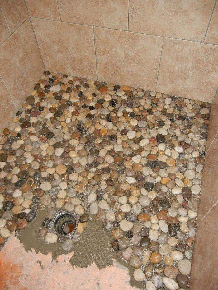 Bring the Outdoors Indoors With This Stone Shower Tiling #homedecor #pebbles #rocks #decorhomeideas