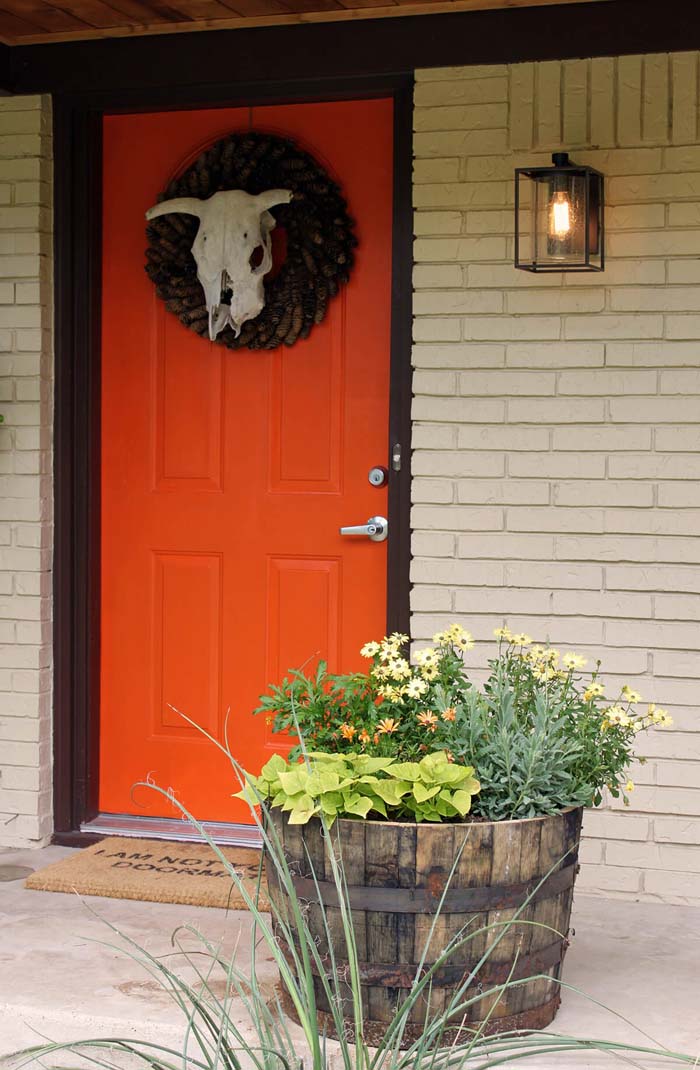 Orange with a Pine Cone Wreath #frontdoorcolor #frontdoor #paintcolor #decorhomeideas