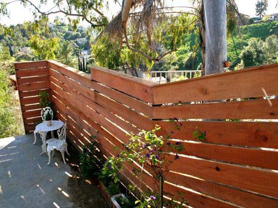 Plank Fence for a Sloping Backyard #privacyfence #diy #fencingideas #decorhomeideas