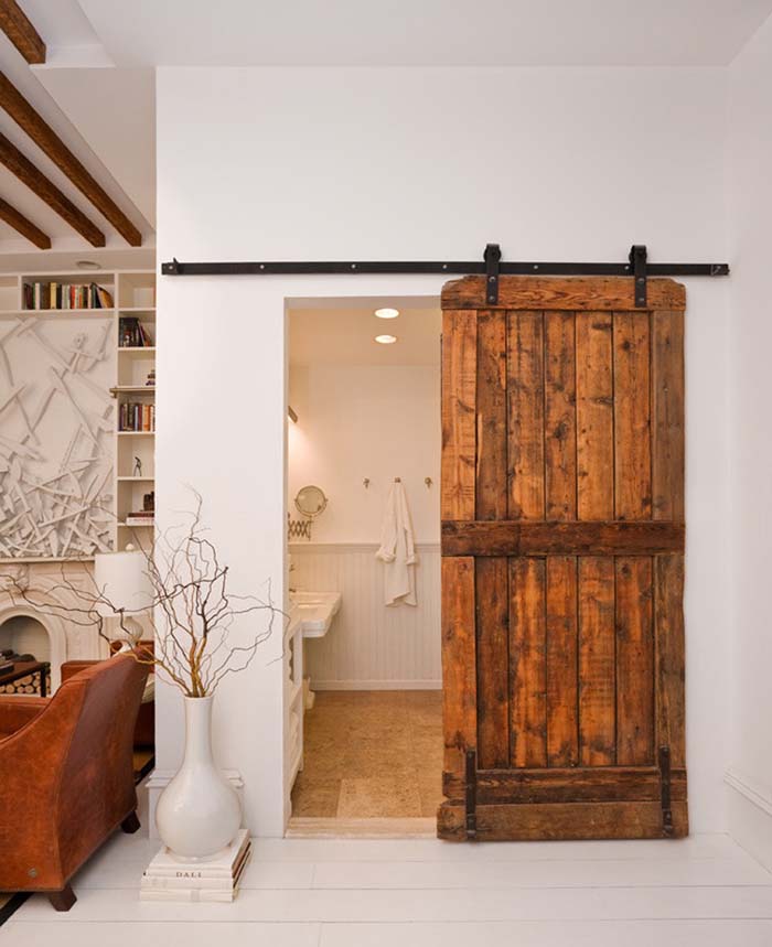 Rolling Barn Door with Black Iron Hardware #rusticbathroom #rusticdecor #decorhomeideas