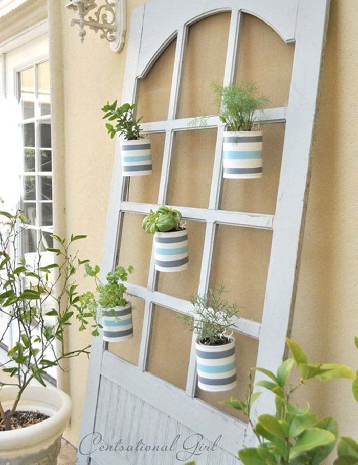 Hang Herb Pots in the Windows #olddooroutdoordecor #olddoorgarden #decorhomeideas