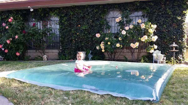 A Massive Water Pillow to Keep Cool #backyardkidsgames #diybackyardgames #decorhomeideas