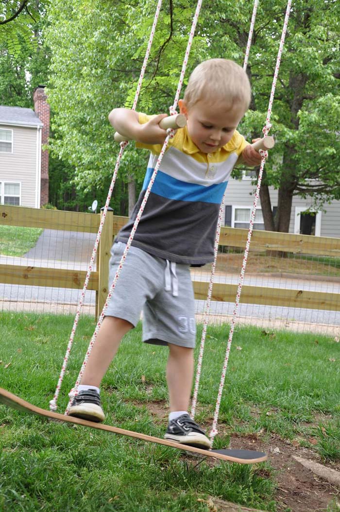 A Skateboard Swing with Handles for Safety #backyardkidsgames #diybackyardgames #decorhomeideas