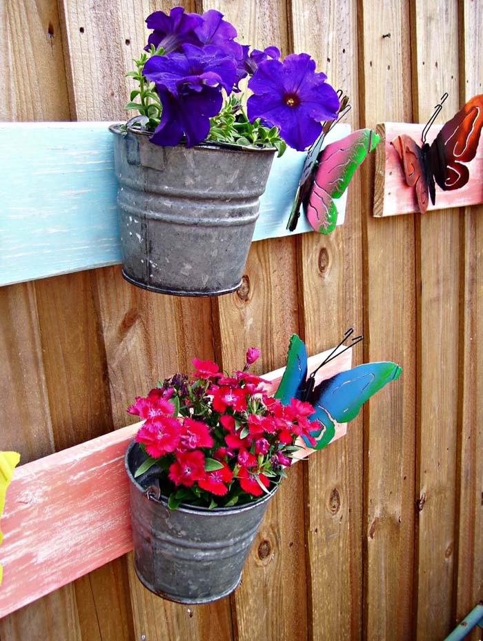 Bright Painted Butterflies on a Board with Pails #repurposedplanter #repurposedcontainer #decorhomeideas