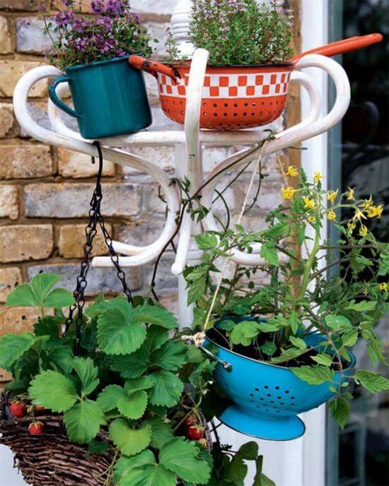 Jumbled Kitchenware Hanging from Hooks #repurposedplanter #repurposedcontainer #decorhomeideas