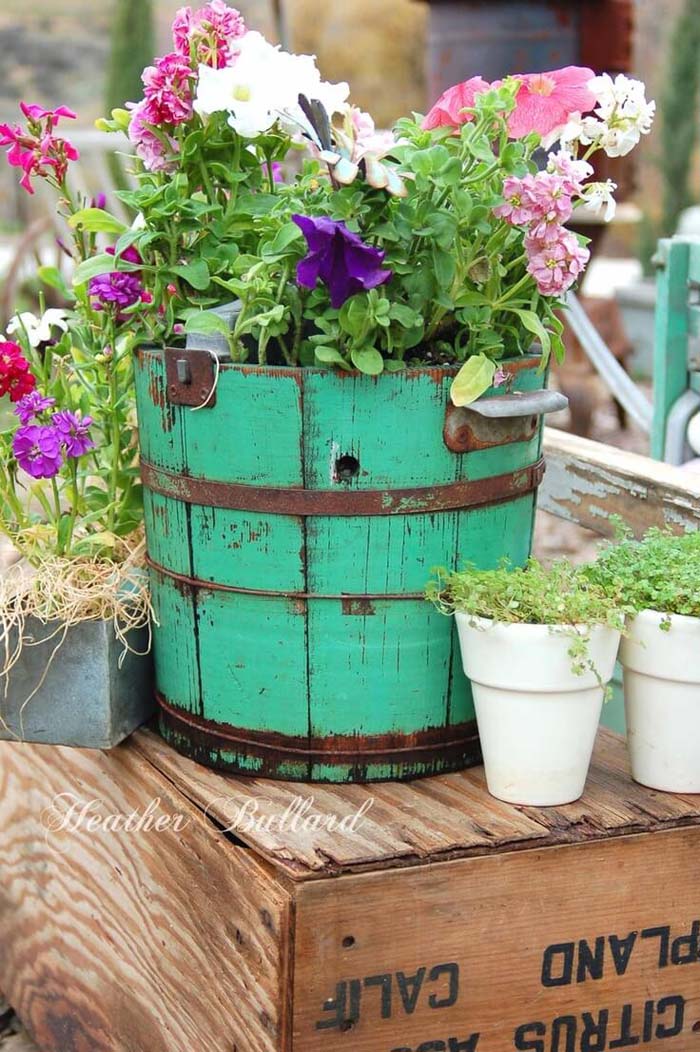 Old Painted Barrels and Crates with Petunias #repurposedplanter #repurposedcontainer #decorhomeideas
