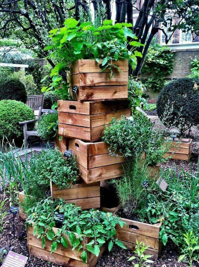 Stacked Crates with Overflowing Greenery #repurposedplanter #repurposedcontainer #decorhomeideas