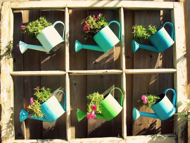 Whimsical Painted Watering Cans with Flowers #repurposedplanter #repurposedcontainer #decorhomeideas