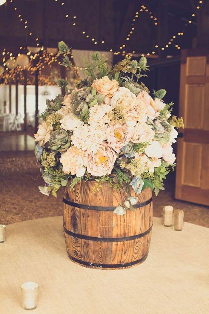 Bevy of Ivory Blooms in Rustic Barrel #flowerarrangementsideas #flowerarrangement #decorhomeideas