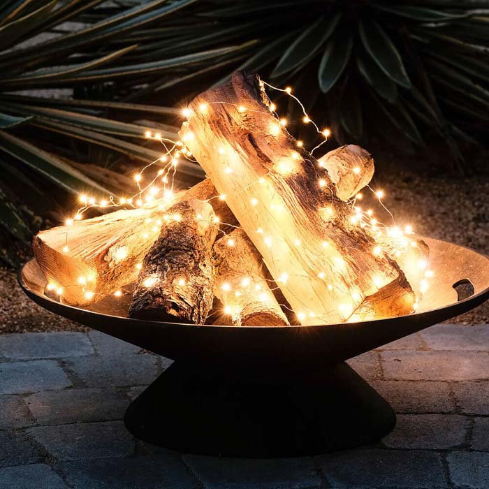 Flameless Fire Pit Fairy Lights #backyardlightingideas #decorhomeideas