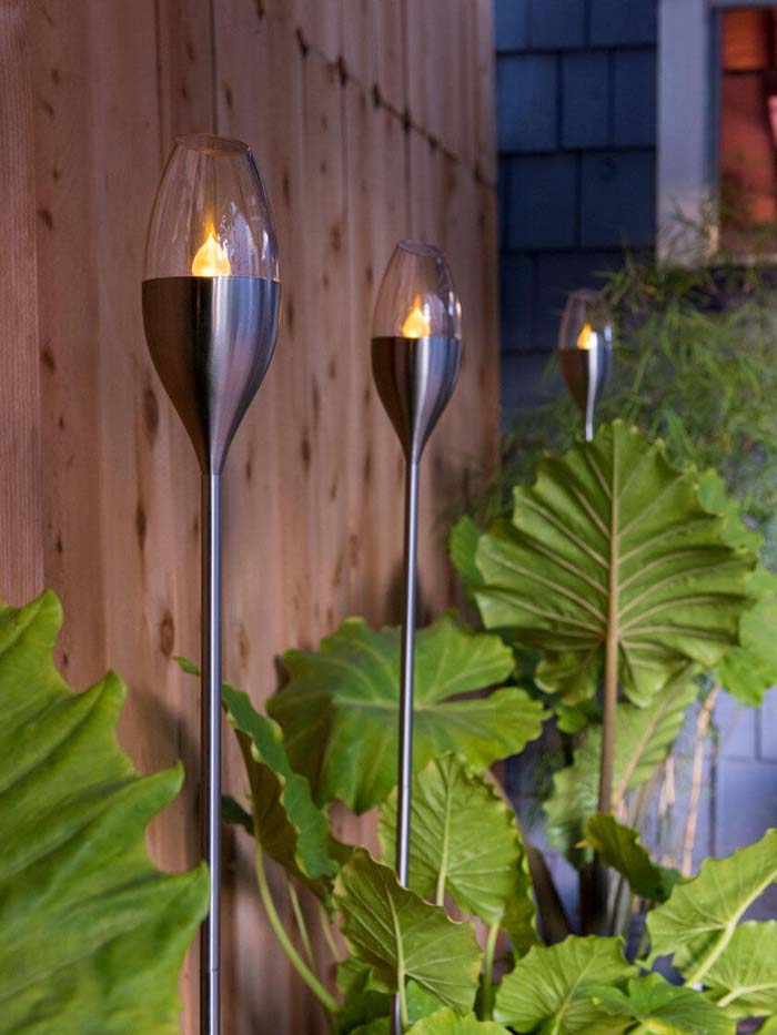 Long and Lean Glass Fluted Patio Torches #backyardlightingideas #decorhomeideas