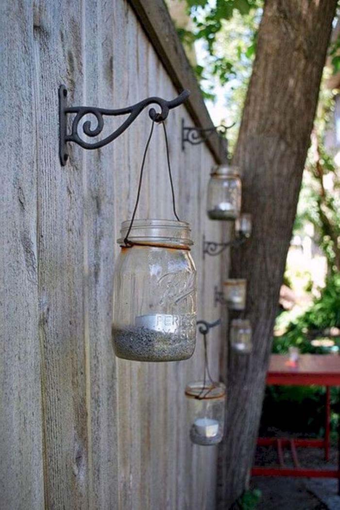 Mason Jar Tea Light Holders on Metal Hooks #gardenfencedecoration #decorhomeideas