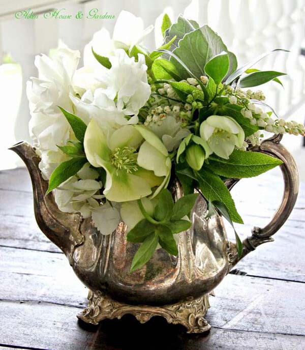 Silver Teapot with Green and White Arrangement #flowerarrangementsideas #flowerarrangement #decorhomeideas