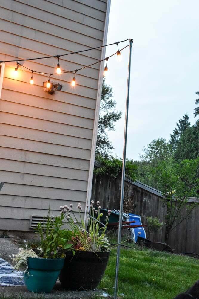 Simple Outdoor Light Strand Patio Upgrade #backyardlightingideas #decorhomeideas