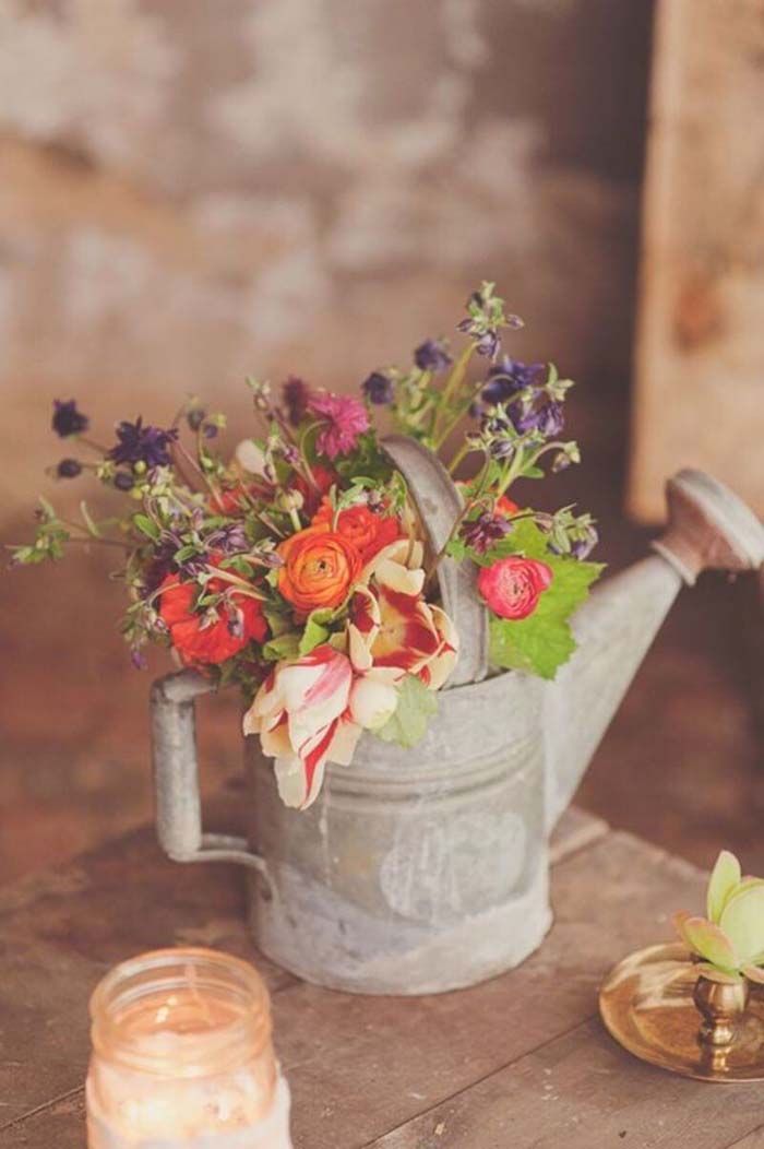 Spring Bouquet in Weathered Watering Can #flowerarrangementsideas #flowerarrangement #decorhomeideas