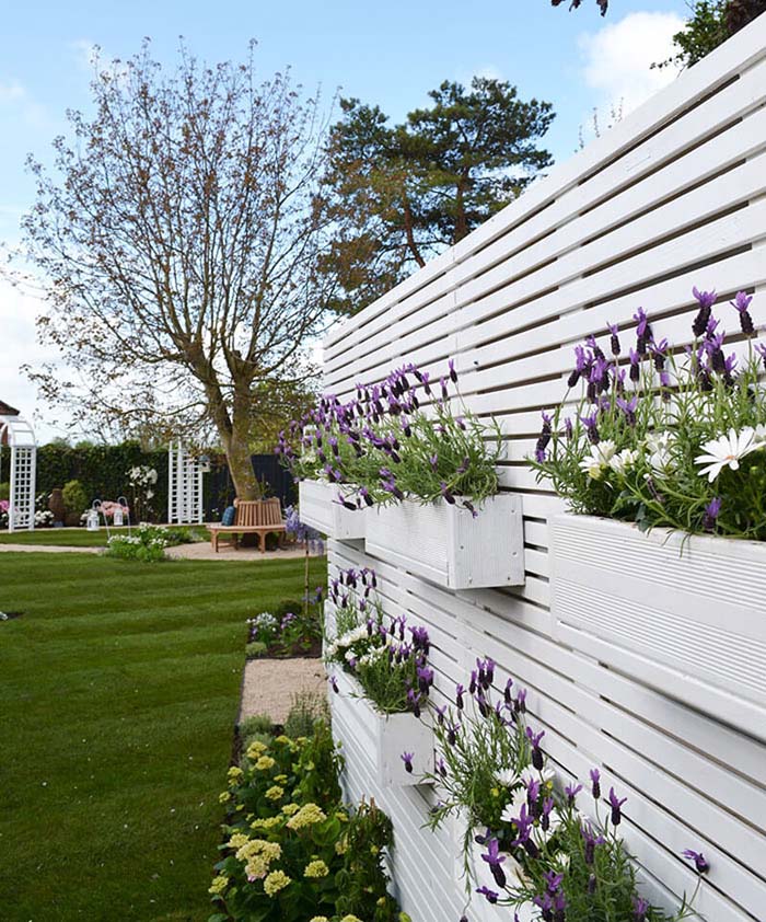 Stacked Window Boxes on a White Fence #gardenfencedecoration #decorhomeideas