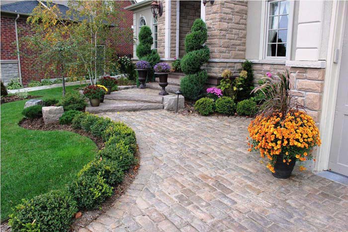 Structured Evergreen Garden Beds with Colorful Planters #frontyardlandscapingideas #decorhomeideas