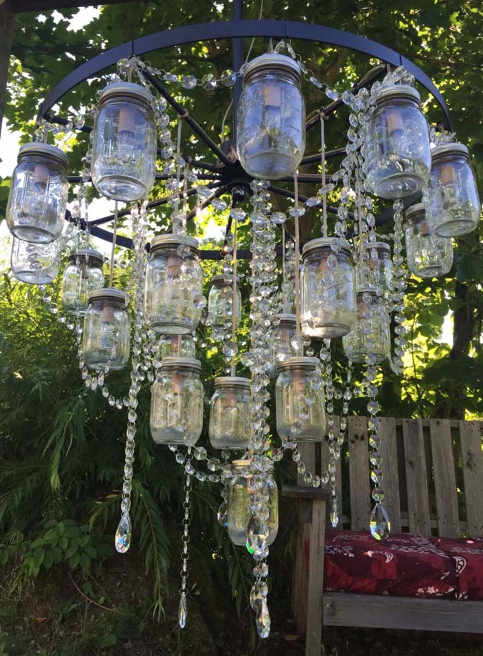 Wagon Wheel Mason Jar and Crystal Chandelier #backyardlightingideas #decorhomeideas