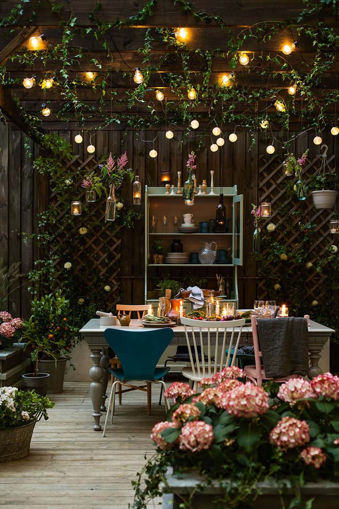 Whimsical Garden Grotto with String Lights #backyardlightingideas #decorhomeideas