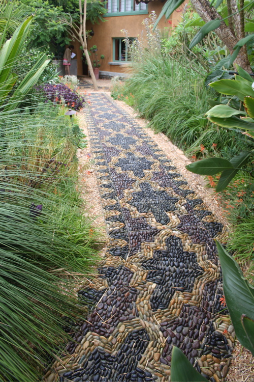 Authentic Black And Brown Stenciled Walkway With Stones