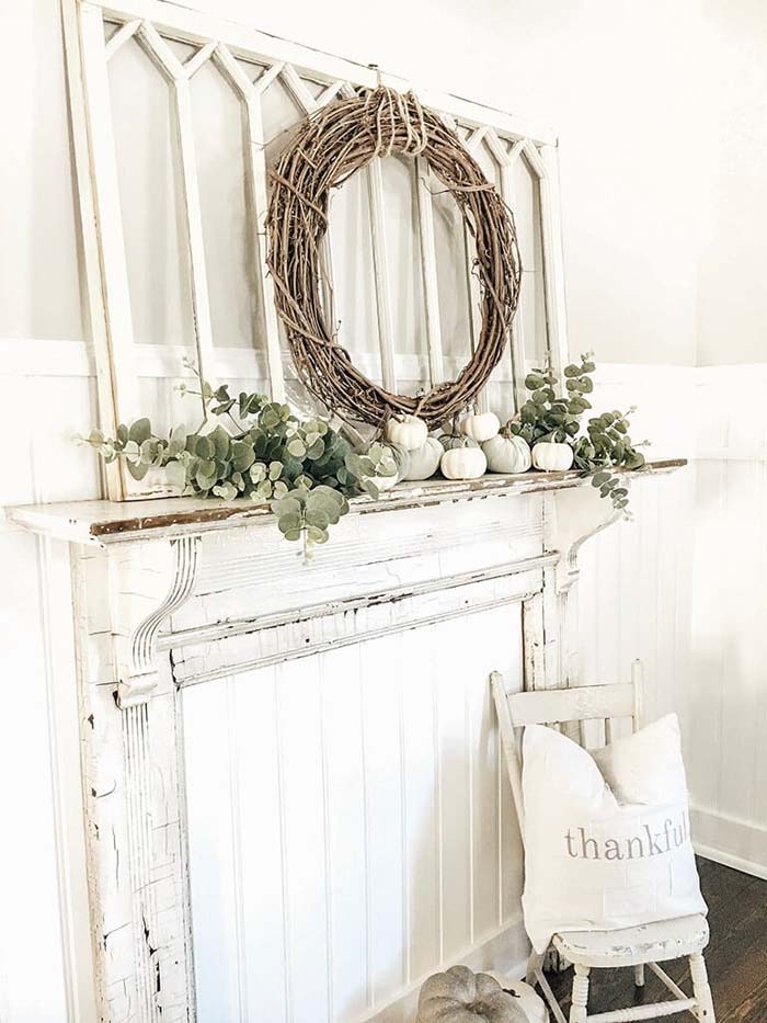 Decorative and Distressed White Faux Fireplace #fallfarmhousedecor #decorhomeideas