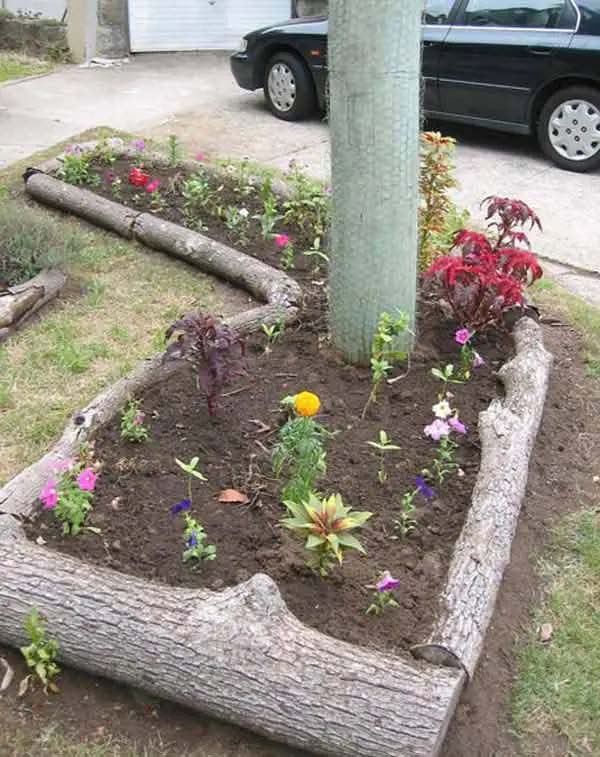 Garden Lined with Repurposed Trees #gardenedgingideas #decorhomeideas