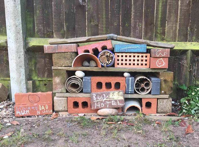 A Bug Hotel with Natural Materials and Recyclables #oldbrickideas #decorhomeideas