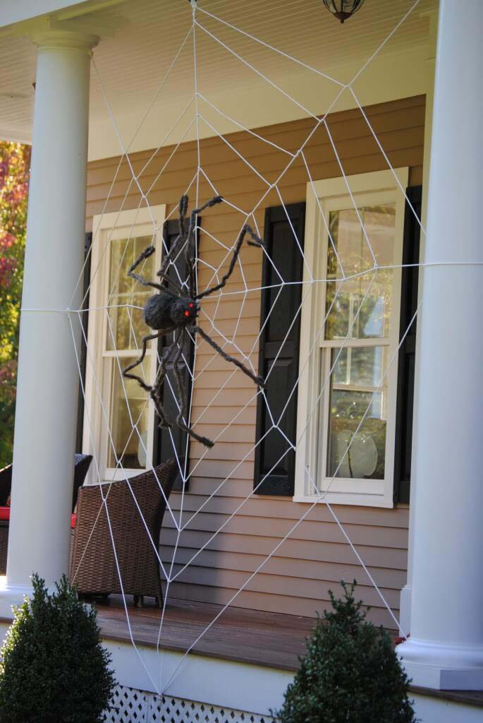 27. Hugely Scary Halloween Porch Spider Web #frontporch #halloween #decorhomeideas