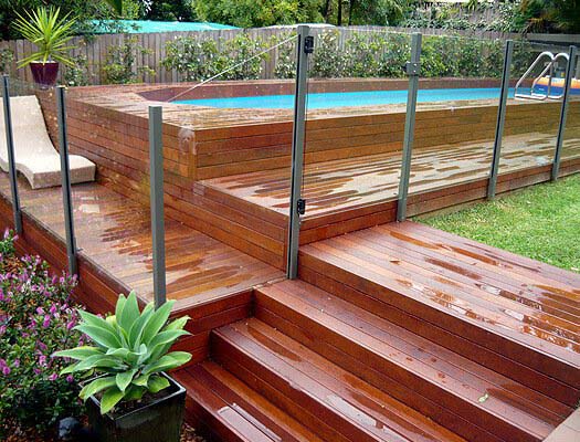 5. Above-Ground Pool with Acrylic Fence #abovegroundpoolwithdeck #decorhomeideas