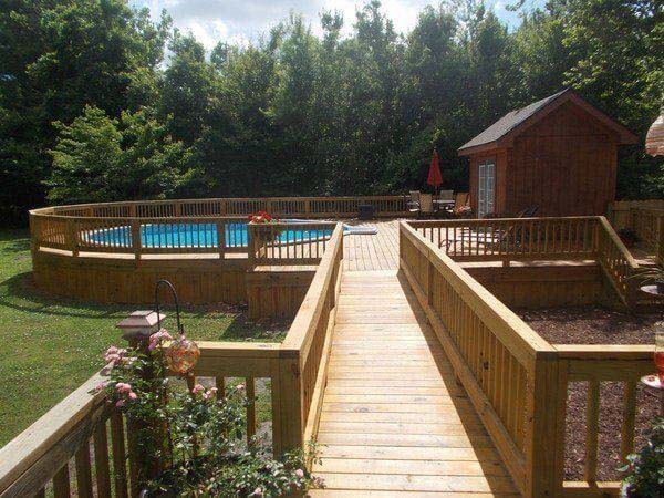 19. Above-Ground Swimming Pool with A Bridge #abovegroundpoolwithdeck #decorhomeideas