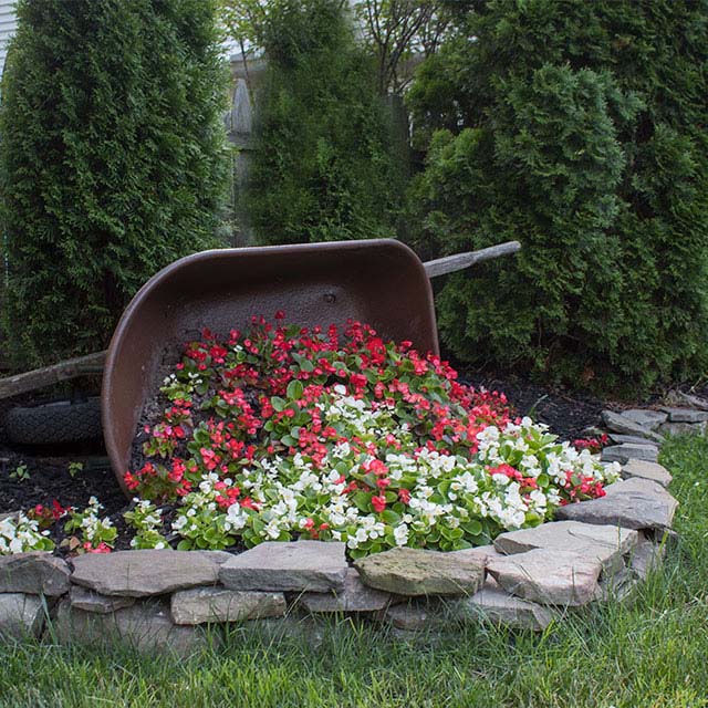 33. DIY Tipped Wheelbarrow Planter #landscapingideas #decorhomeideas