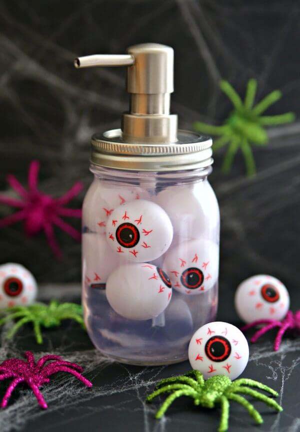 19. Ghostly Red Eye Soap Dispenser Mason Jar #halloween #masonjar #crafts #decorhomeideas