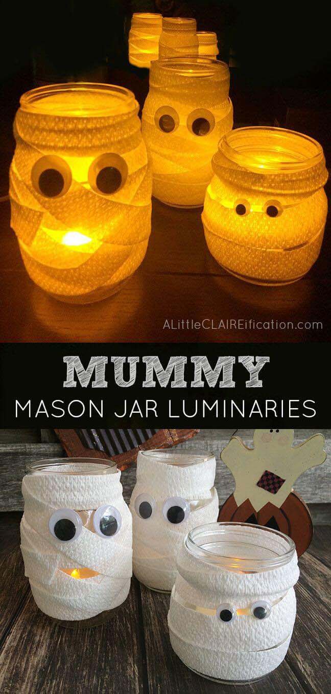 20. Googly-Eyed Mummy Mason Jar Luminaries #halloween #masonjar #crafts #decorhomeideas