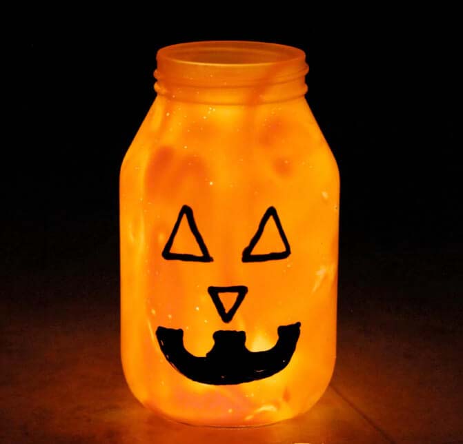 25. Illuminated Halloween Pumpkin Mason Jar #halloween #masonjar #crafts #decorhomeideas