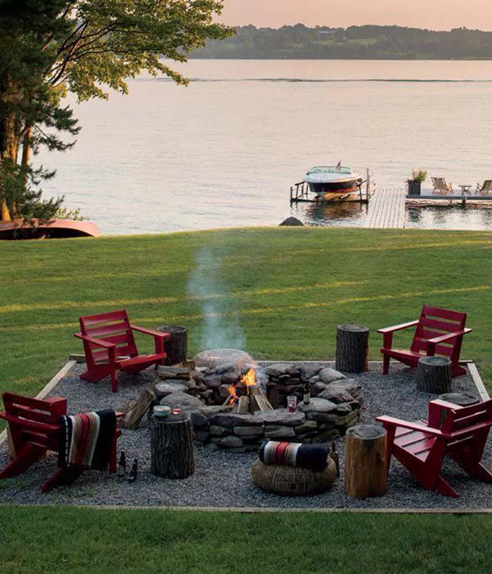 13. Lakeside Fire Pit with Adirondack Chairs and Tree-Stump Side Tables #firepit #seating #decorhomeideas