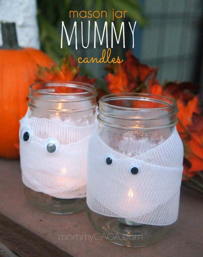 31. Mummy Wrapped Mason Jar Candle Holders #halloween #masonjar #crafts #decorhomeideas
