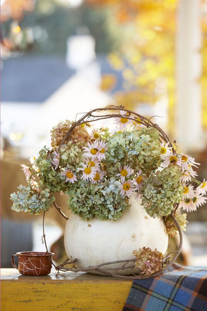 23. Pumpkin Vase With Small Fall Flowers #fallflowers #arrangements #decorhomeideas