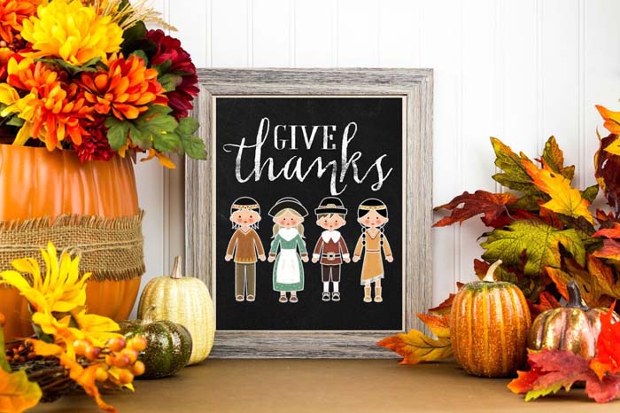 34. Thanksgiving Figures on Chalkboard with Pumpkins and Fall Foliage #thanksgiving #decor #decorhomeideas