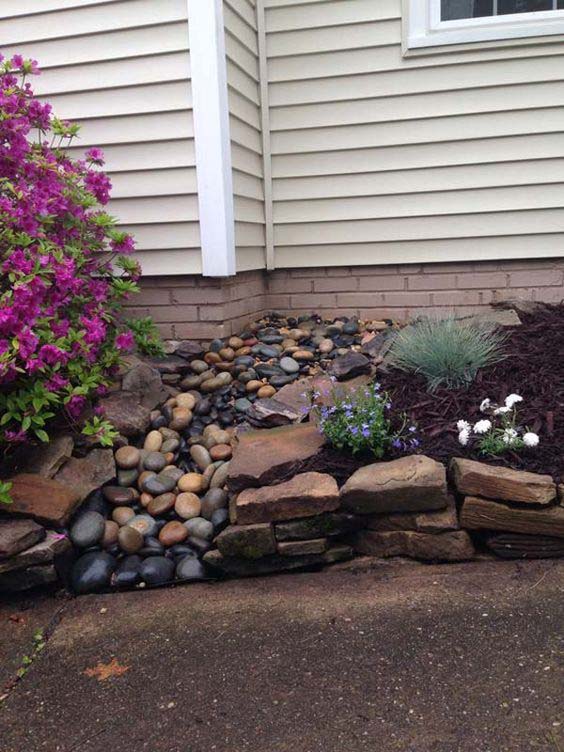 A Black Pebble Dry Creek With Rocks #downspout #landscaping #rocks #decorhomeideas